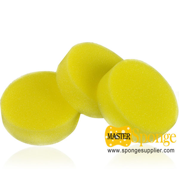 yellow round car waxing sponge